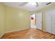 Simple bedroom with laminate flooring and an open doorway at 12821 Gettysburg Cir, Orlando, FL 32837