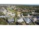 Aerial view showcasing a golf course community with numerous houses at 1501 Edgewater Dr, Mount Dora, FL 32757