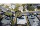 Aerial view of a residential neighborhood with houses and lush landscaping at 1501 Edgewater Dr, Mount Dora, FL 32757