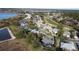 Aerial perspective of a neighborhood near a lake and golf course at 1501 Edgewater Dr, Mount Dora, FL 32757