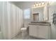 Clean bathroom with single vanity and tub shower combo at 1501 Edgewater Dr, Mount Dora, FL 32757