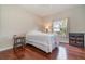 Cozy bedroom with wood floors and ample natural light at 1501 Edgewater Dr, Mount Dora, FL 32757