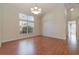 Bright dining room featuring hardwood floors and a chandelier at 1501 Edgewater Dr, Mount Dora, FL 32757