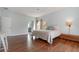 Main bedroom with hardwood floors and ensuite bathroom at 1501 Edgewater Dr, Mount Dora, FL 32757