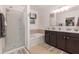 Relaxing bathroom with a soaking tub, double vanity, and shower at 1569 Tamarind Rd, Davenport, FL 33896