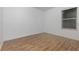 Empty bedroom with laminate wood flooring at 1569 Tamarind Rd, Davenport, FL 33896