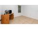 Simple bedroom with wood-look floors and a desk at 1569 Tamarind Rd, Davenport, FL 33896