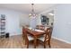 Dining room with a wood table and six chairs, view of kitchen at 1569 Tamarind Rd, Davenport, FL 33896