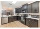 Kitchen with dark-brown cabinets, stainless steel appliances, and granite countertops at 1569 Tamarind Rd, Davenport, FL 33896