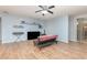 Bright living room featuring hardwood floors and a comfy futon at 1569 Tamarind Rd, Davenport, FL 33896