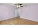 Bedroom with hardwood floors and access to bathroom at 1605 S Mary St, Eustis, FL 32726