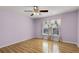 Light-filled bedroom featuring hardwood floors at 1605 S Mary St, Eustis, FL 32726