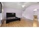 Main bedroom with dark wood platform bed and laminate wood floors at 1605 S Mary St, Eustis, FL 32726