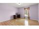 Bedroom with wood floors and a built-in desk at 1605 S Mary St, Eustis, FL 32726