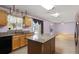 Kitchen with island and view into living room at 1605 S Mary St, Eustis, FL 32726