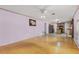 Spacious living room featuring hardwood floors and a view of the kitchen at 1605 S Mary St, Eustis, FL 32726