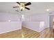 Bright loft area featuring hardwood floors and a ceiling fan at 1605 S Mary St, Eustis, FL 32726