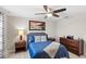 Spacious bedroom with a full bed and dark wood dresser at 16133 Pebble Bluff Loop, Winter Garden, FL 34787