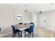 Dining area with a table and four chairs, near entryway at 16133 Pebble Bluff Loop, Winter Garden, FL 34787