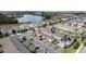 Aerial view of a townhouse community near a lake at 16926 Reseda Aly, Winter Garden, FL 34787