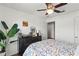 Bedroom with a floral comforter and ceiling fan at 16926 Reseda Aly, Winter Garden, FL 34787