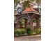 Ornate brick entrance with clock tower and landscaping, welcoming you to Winter Garden at 16926 Reseda Aly, Winter Garden, FL 34787