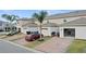 Three townhouses with individual garages and paved driveways at 16926 Reseda Aly, Winter Garden, FL 34787