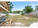 Large backyard with a partially built structure and open space at 1705 Geigel Ave, Orlando, FL 32806