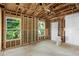 Unfinished bedroom in a house under construction with new window at 1705 Geigel Ave, Orlando, FL 32806