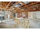 Interior of a home under construction, showcasing exposed framing and unfinished areas at 1705 Geigel Ave, Orlando, FL 32806