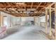 Interior of a house under construction, showing exposed framing and unfinished rooms at 1705 Geigel Ave, Orlando, FL 32806