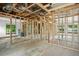 Interior framing of a house under construction with electrical and plumbing at 1705 Geigel Ave, Orlando, FL 32806