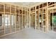 Interior framing of a house under construction with electrical and plumbing at 1705 Geigel Ave, Orlando, FL 32806