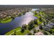 Aerial view showing lakefront property and community at 181 Tall Pines Pass, Kissimmee, FL 34759