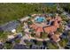 Community clubhouse with pool and tennis courts at 181 Tall Pines Pass, Kissimmee, FL 34759