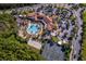 Resort-style community pool, tennis courts, and clubhouse at 181 Tall Pines Pass, Kissimmee, FL 34759