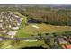 Aerial view of a house and golf course at 181 Tall Pines Pass, Kissimmee, FL 34759