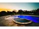 Luxury pool and spa with lighting, at sunset at 19229 E Peabody St, Orlando, FL 32833