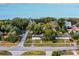 Aerial view showing a house near the waterfront and other homes at 208 S Main Ave, Minneola, FL 34715