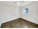 Simple bedroom with dark tile floors and a window with natural light at 211 Palm Pl, Sanford, FL 32773