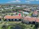 Aerial view of condo building near tennis court and lake at 2419 Gallery View Dr # 10, Winter Park, FL 32792