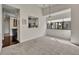 Dining area with kitchen passthrough and view into the living room at 2419 Gallery View Dr # 10, Winter Park, FL 32792