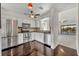 Modern kitchen with stainless steel appliances and dark hardwood floors at 2419 Gallery View Dr # 10, Winter Park, FL 32792