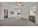 Spacious living room featuring a fireplace and views into the kitchen and dining area at 2419 Gallery View Dr # 10, Winter Park, FL 32792