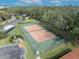 Community tennis court with green perimeter fence at 2419 Gallery View Dr # 10, Winter Park, FL 32792