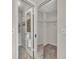 Large walk-in closet with mirrored doors and shelving at 2419 Gallery View Dr # 10, Winter Park, FL 32792