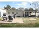 Brick patio with fire pit and Adirondack chairs at 2420 Musselwhite Ave, Orlando, FL 32804