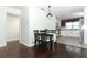 Small dining area with dark hardwood floors and a modern light fixture at 2420 Musselwhite Ave, Orlando, FL 32804