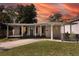 Updated one-story home with covered porch and modern gray exterior at 2420 Musselwhite Ave, Orlando, FL 32804