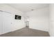 Bedroom featuring a closet and a mounted TV on a neutral colored wall at 2438 Pearl Cider Street, Orlando, FL 32824